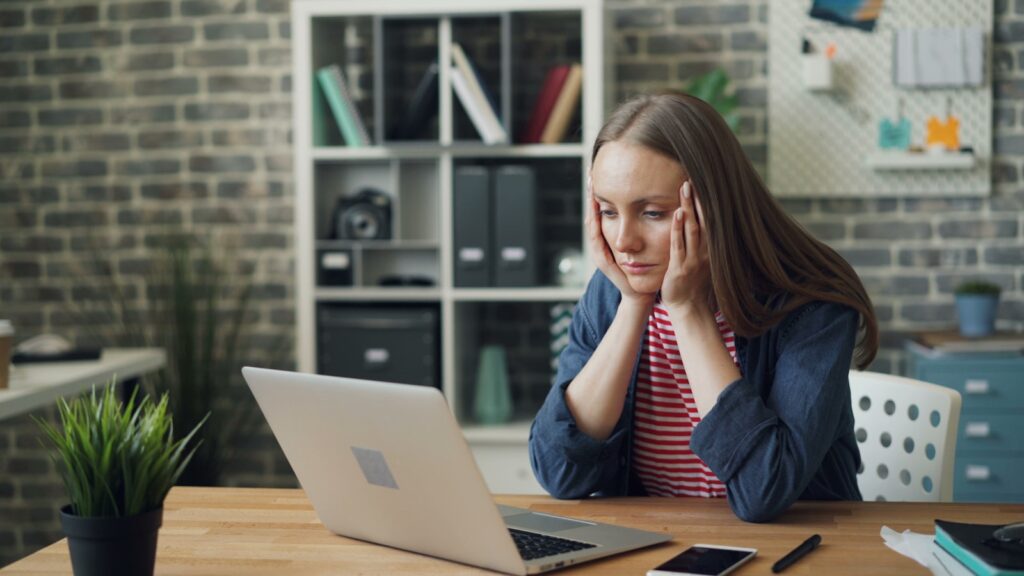 worried about workmans comp - girl reviewing her workmans comp payment

