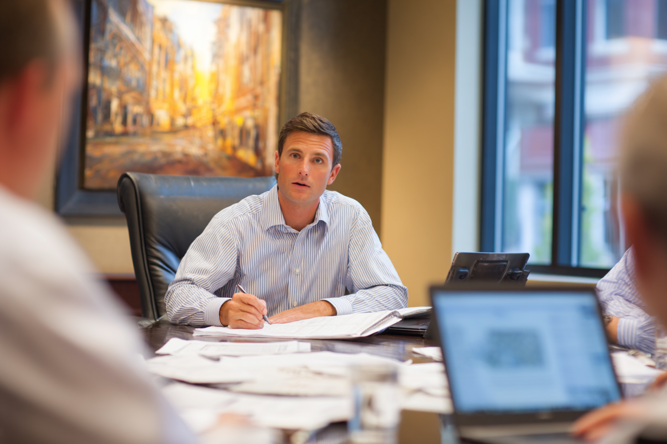 commercial insurance broker consulting with business executives about comprehensive commercial coverage including property and liability insurance